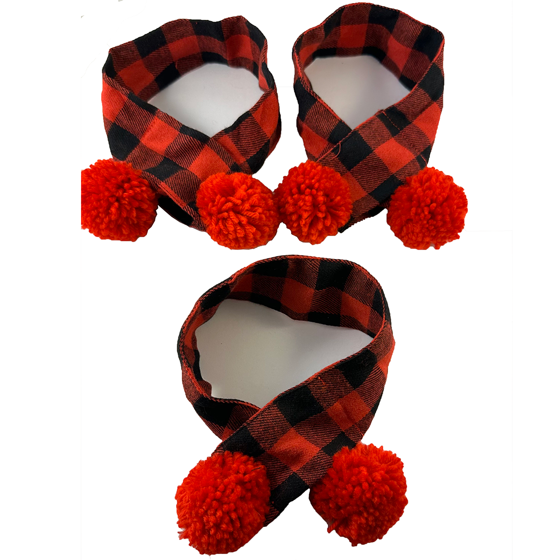 thumbnail image 2 of A Llama Wearing A Red And Black Plaid Scarf Stands In A Field Of Fallen 2 of 14